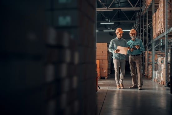 inventory supervisor walking in warehouse